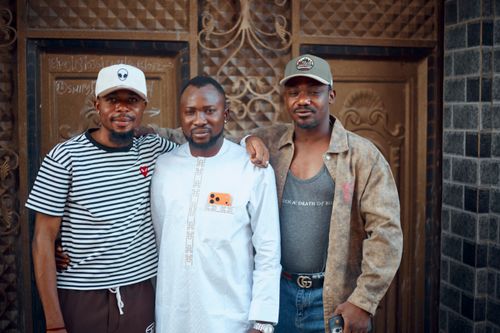 Free Three men posing outdoors in casual attire, expressing camaraderie and friendship. Stock Photo