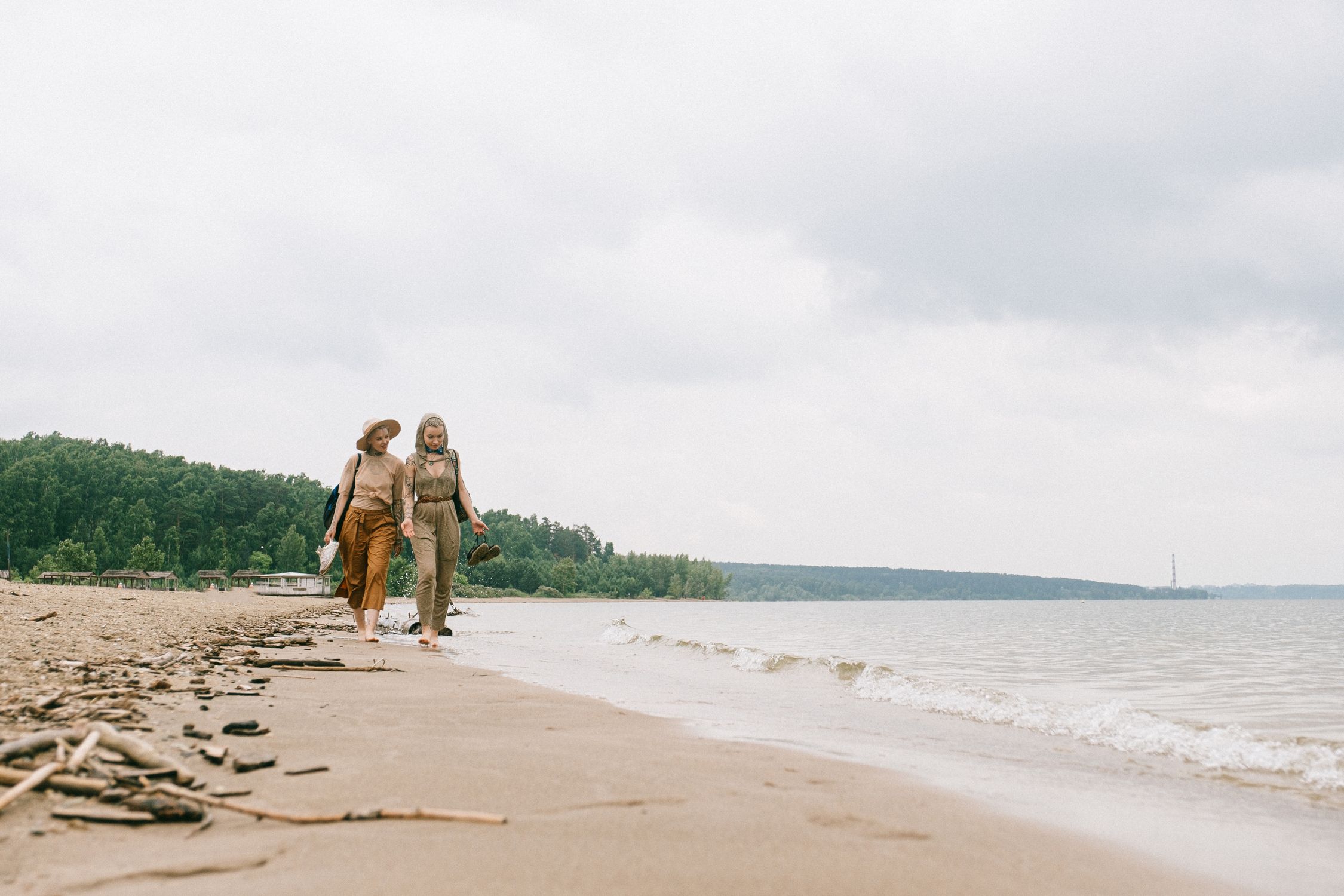 Two Women Walking On Beach · Free Stock Photo