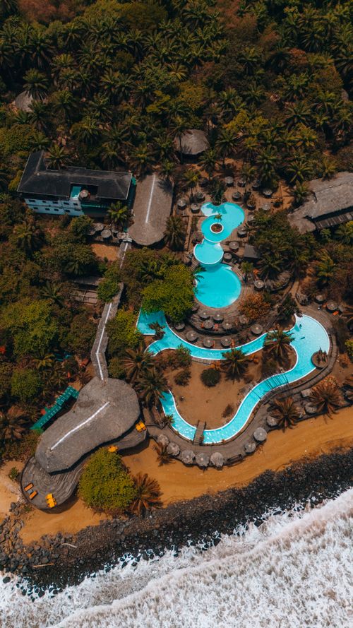 Free Scenic aerial photograph of a luxurious beachfront resort in Margibi, Liberia. Stock Photo