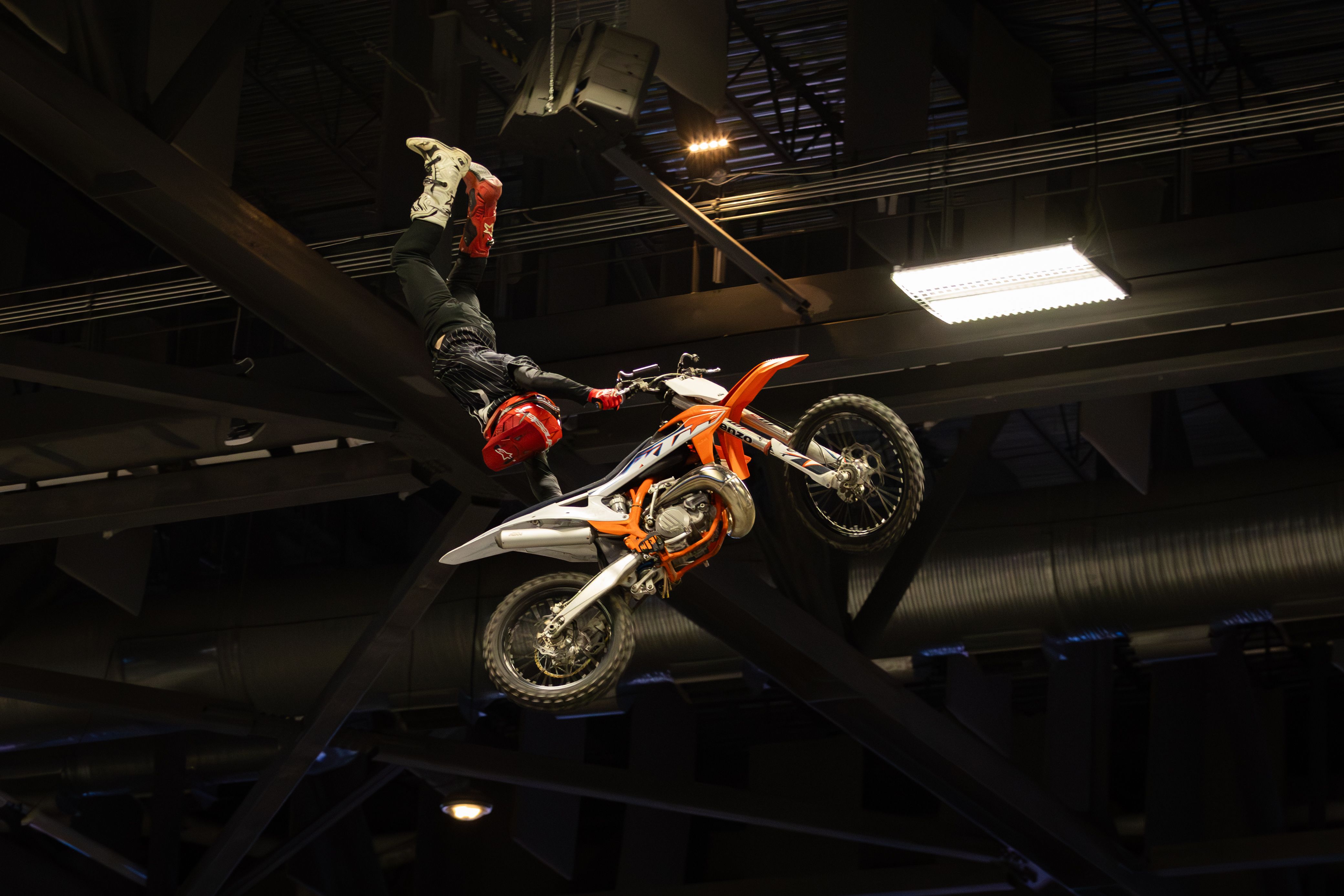 Daring Motocross Stunt in Indoor Arena · Free Stock Photo