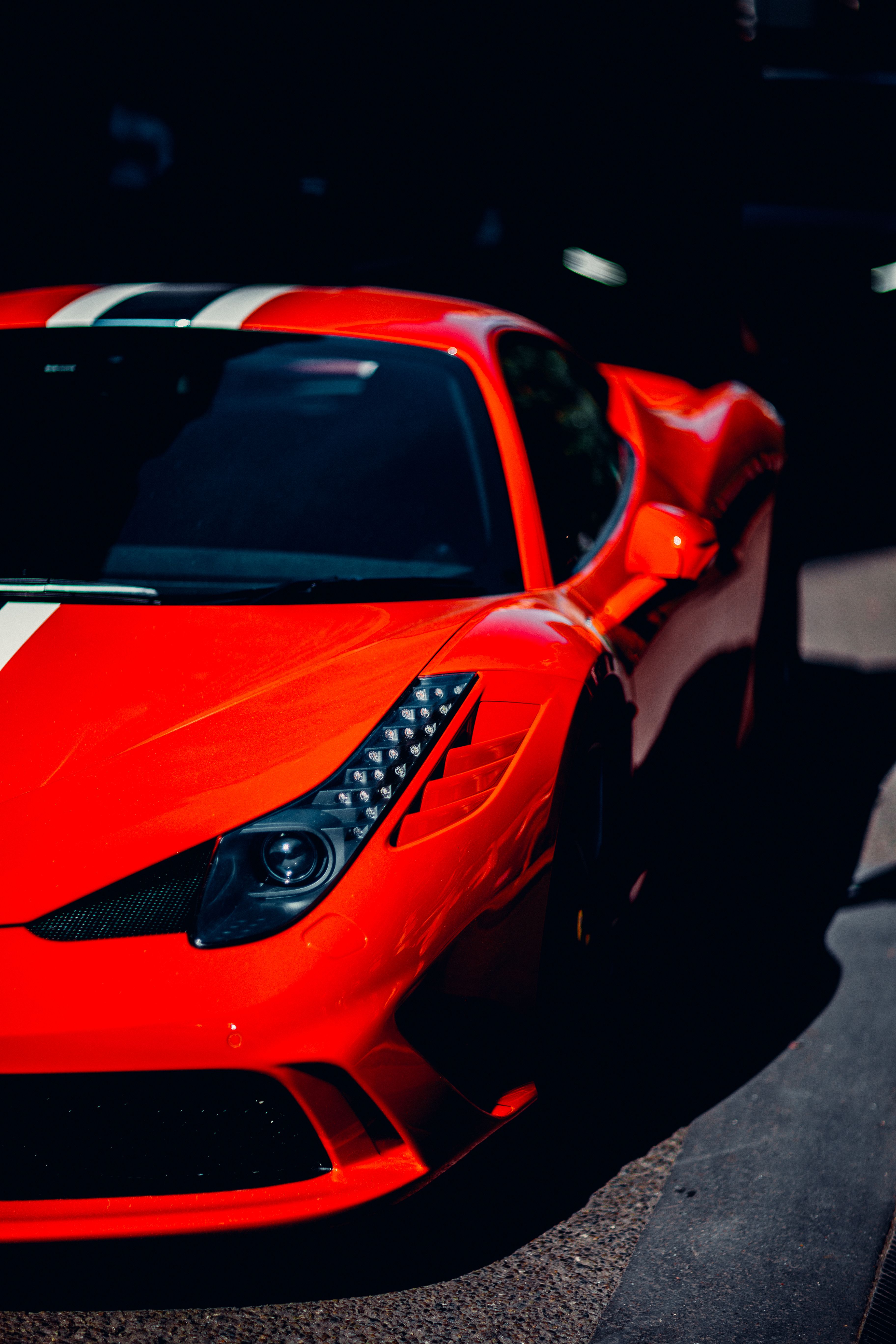 Close-up of a vibrant red sports car in motion · Free Stock Photo