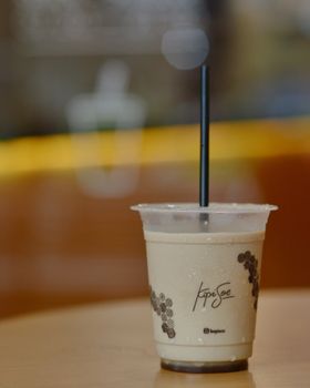 Aesthetic iced coffee photo in Bandung café, perfect for coffee lovers.