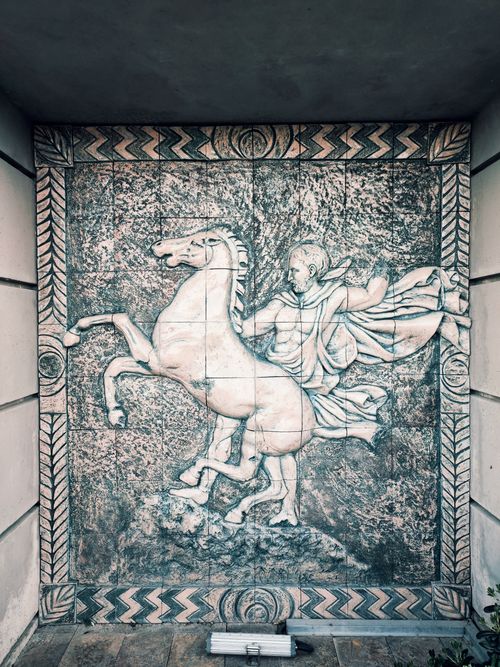 Free Intricate ancient relief depicting a horseman, showcasing classical artistry. Stock Photo