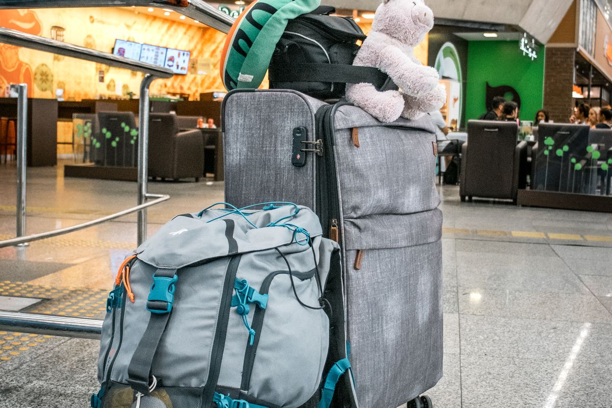 Suitcases standing in an airport arrivals area