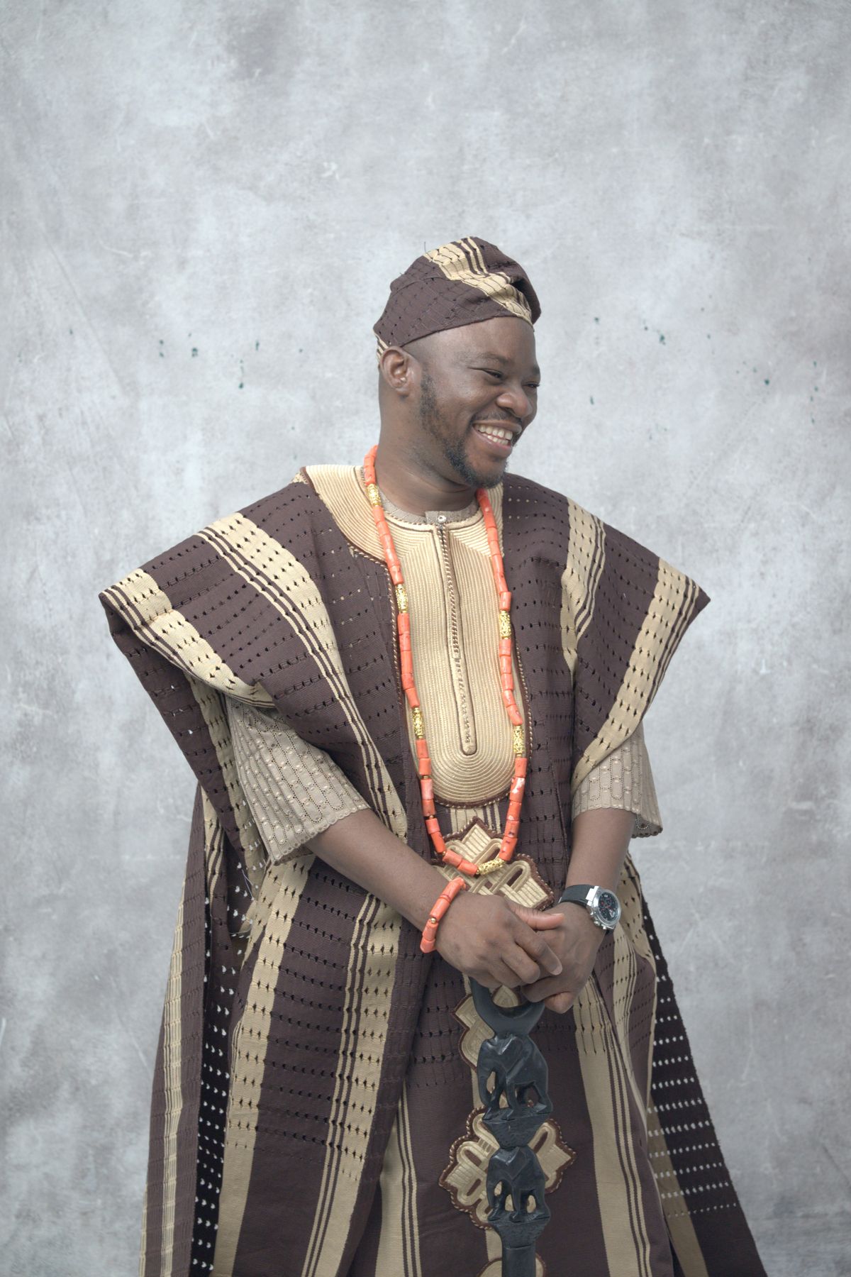 Man in traditional attire with beads
