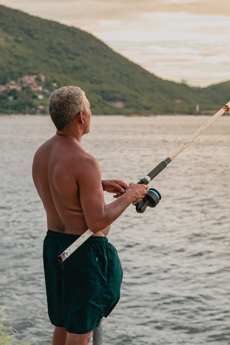 Man Holding Fishing Rod