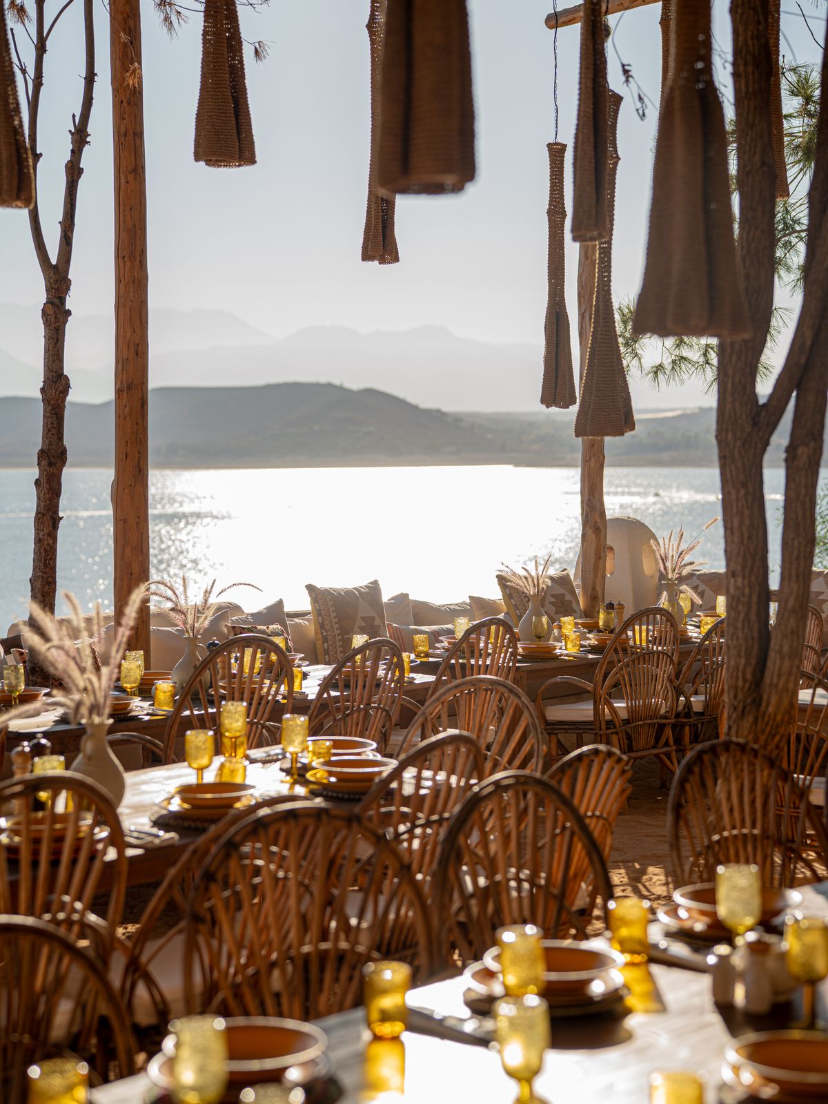 A sunlit outdoor restaurant with a scenic sea view in Ibiza