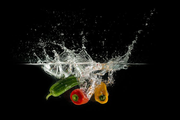 Bell Peppers Dropped On Water