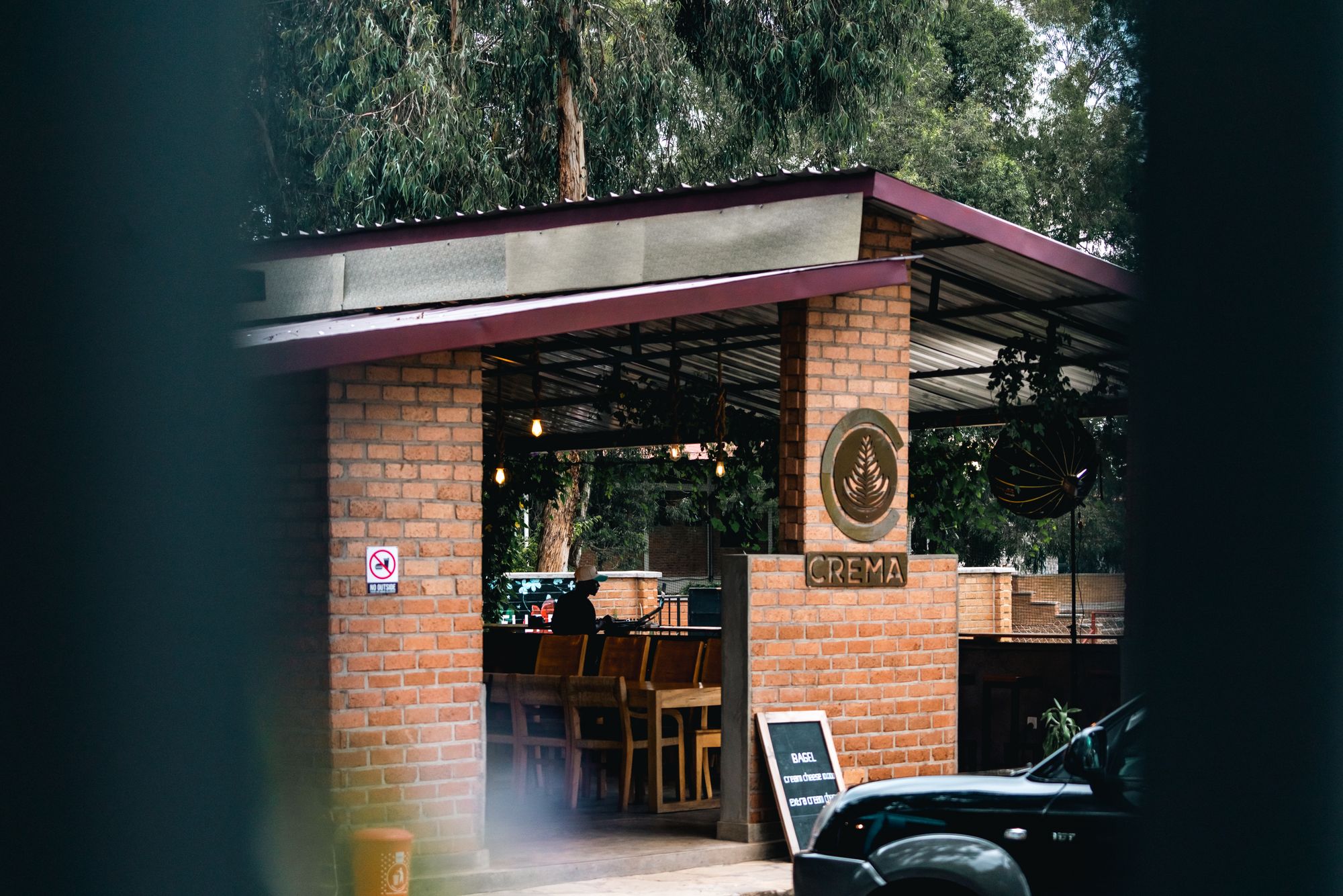 Outdoor cafe with brick walls and seating