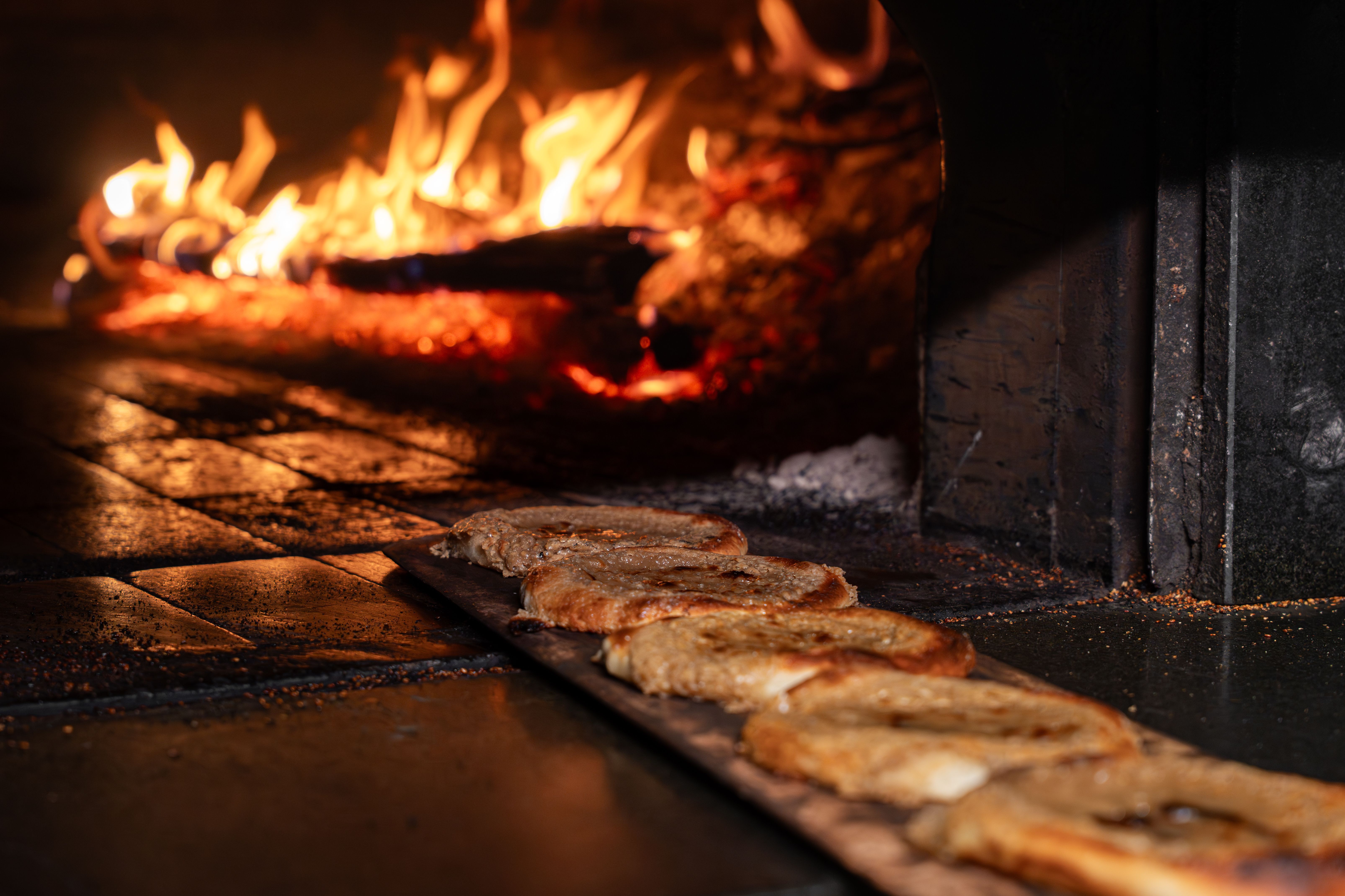 Blistered wood-fired sourdough with cultured butter and olive oil