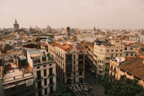Free Breathtaking aerial view of Valencia's historic cityscape with iconic architecture under a warm sky. Stock Photo