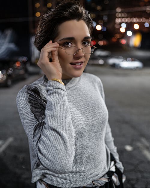 Woman Wearing Gray Sweater and Eyeglasses
