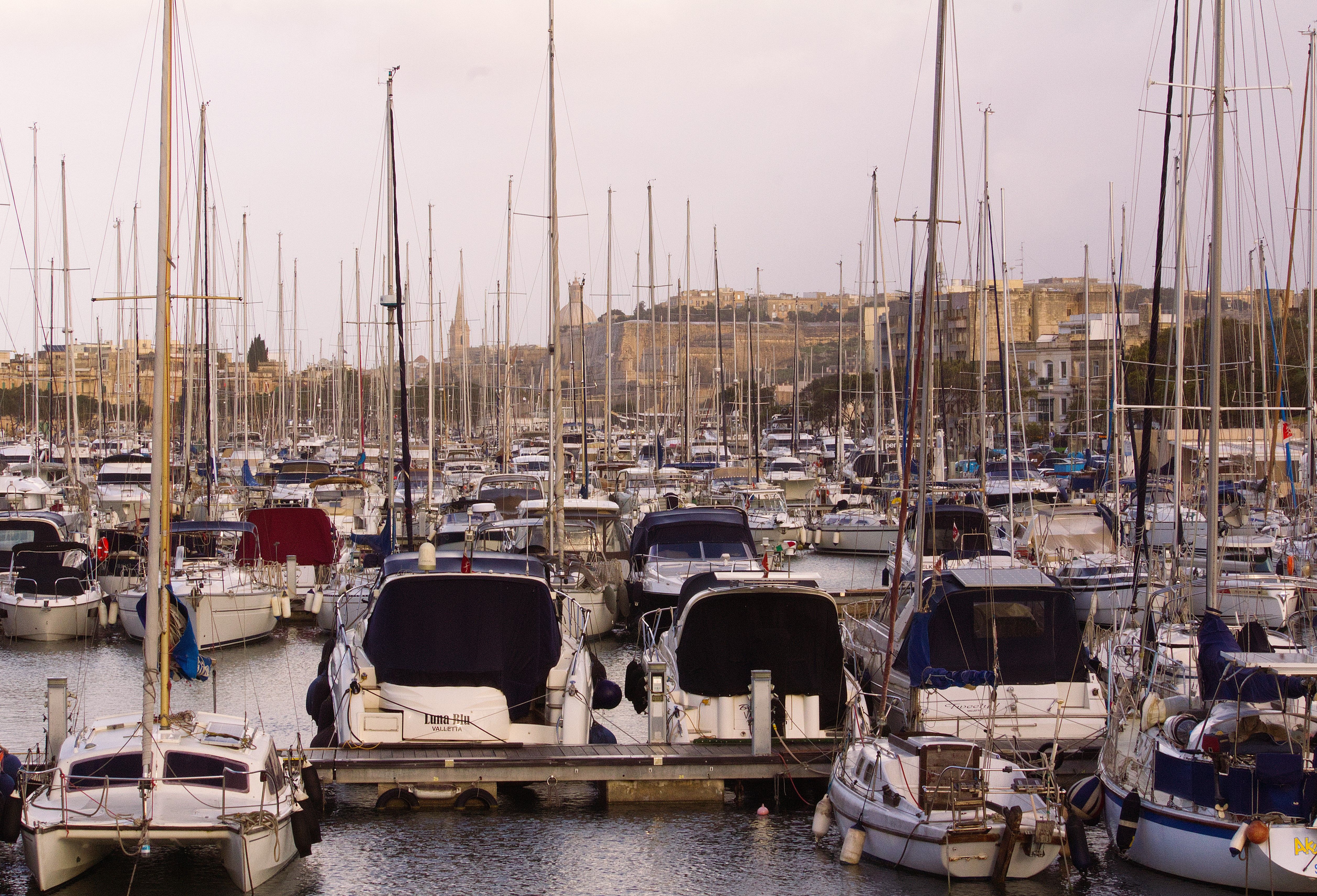 Breathtaking Magic Sunset Cruise in Malta Review: An Unforgettable Evening on the Mediterranean Review 2026 - A picturesque marina filled with yachts and sailboats against a historic city backdrop.