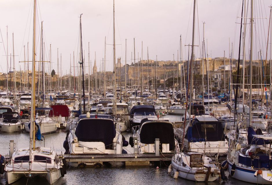Breathtaking Magic Sunset Cruise in Malta Review: An Unforgettable Evening on the Mediterranean Review 2026 - A picturesque marina filled with yachts and sailboats against a historic city backdrop.