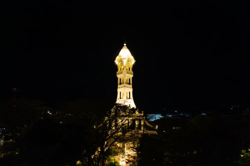 Free Stunning night shot of the illuminated tower in San Vicente, El Salvador, showcasing its architectural beauty. Stock Photo