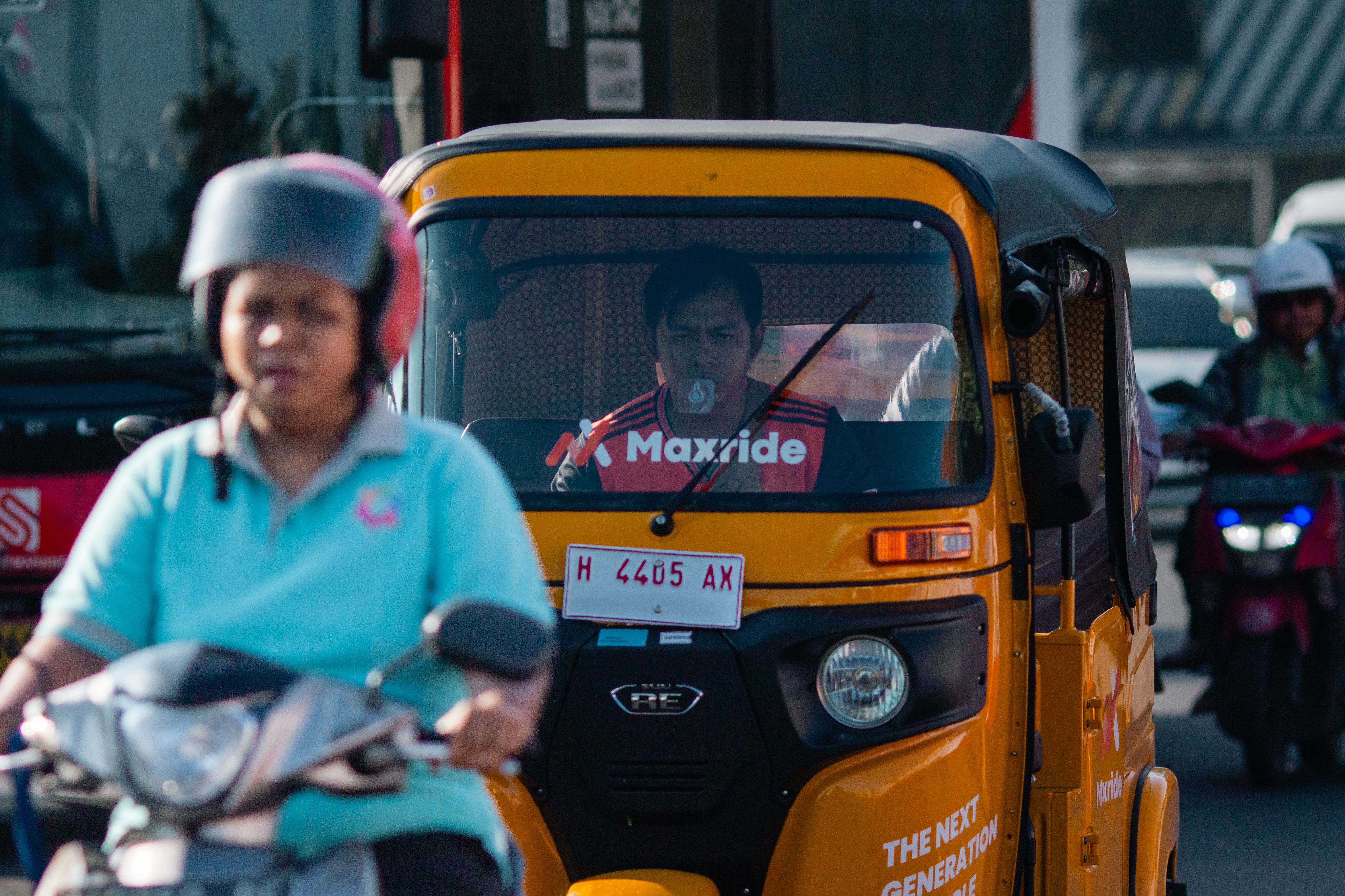 Busy Street with Motorbike and Auto Rickshaw in Traffic