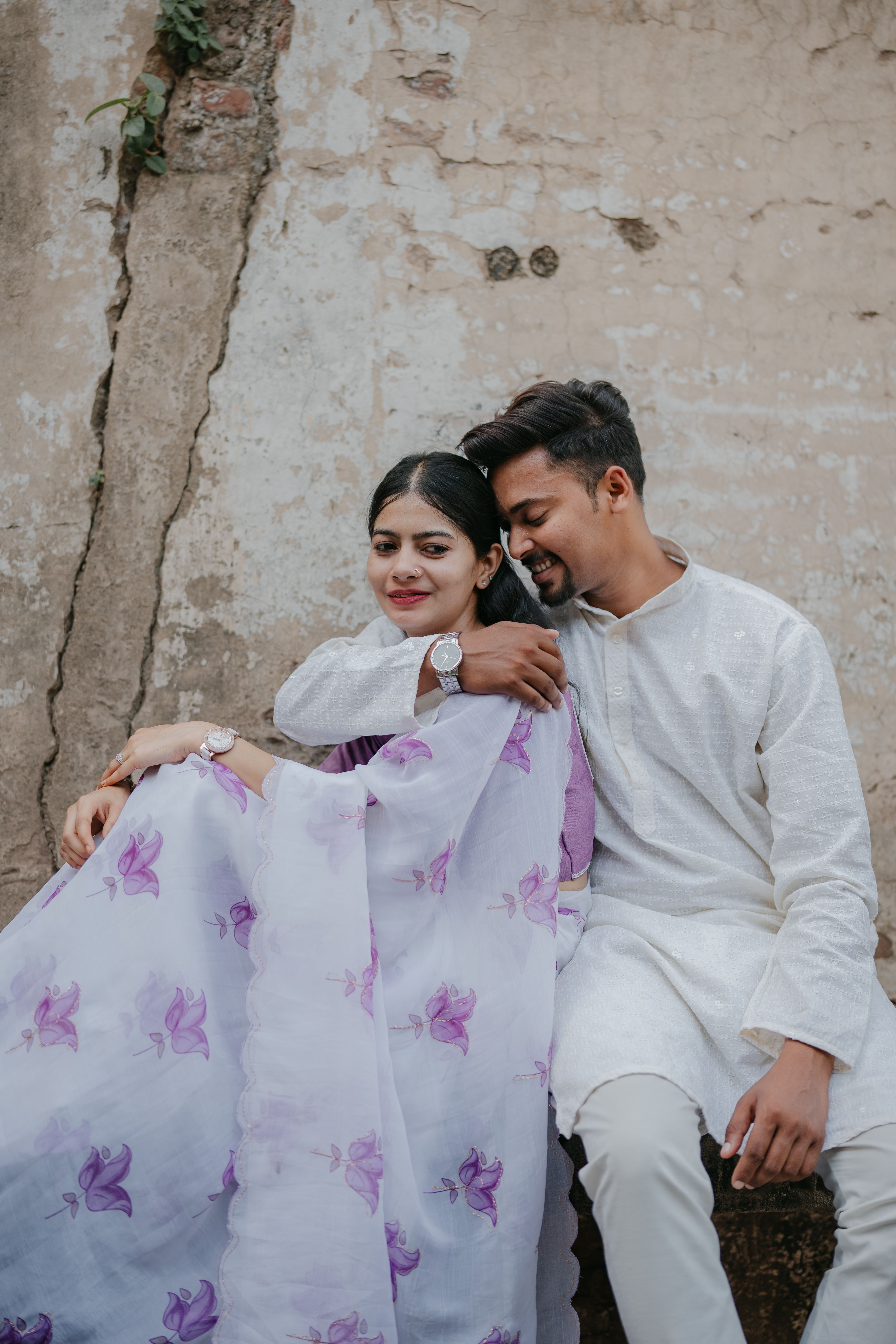 Romantic Couple Embracing Outdoors in Traditional Attire · Free Stock Photo