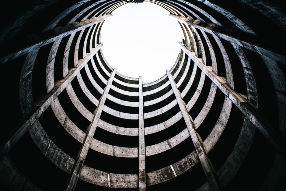 View from below of an abandoned concrete spiral parking structure in urban San Francisco. View from below of an abandoned concrete spiral parking structure in urban San Francisco.