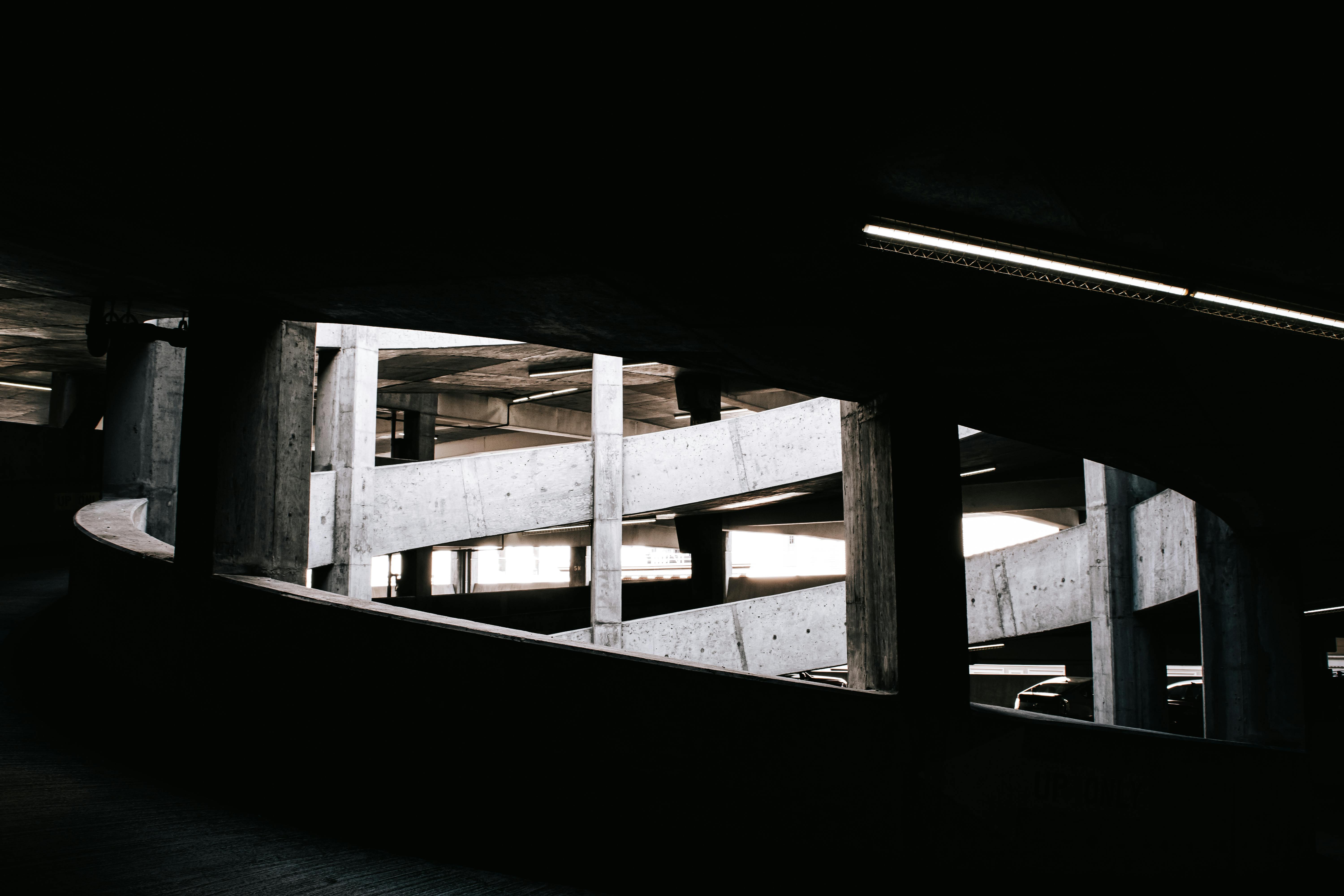 Abstract view of a spiral concrete ramp in a San Francisco parking structure, highlighting industrial design.