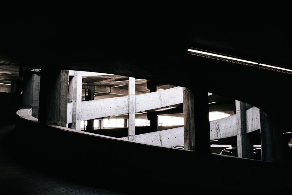 Abstract view of a spiral concrete ramp in a San Francisco parking structure, highlighting industrial design.