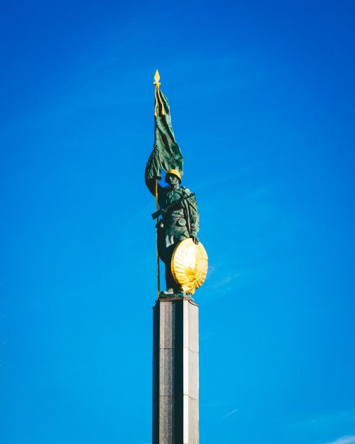 Free Elevated view of the Soviet War Memorial statue in Vienna, Austria against a bright blue sky. Stock Photo