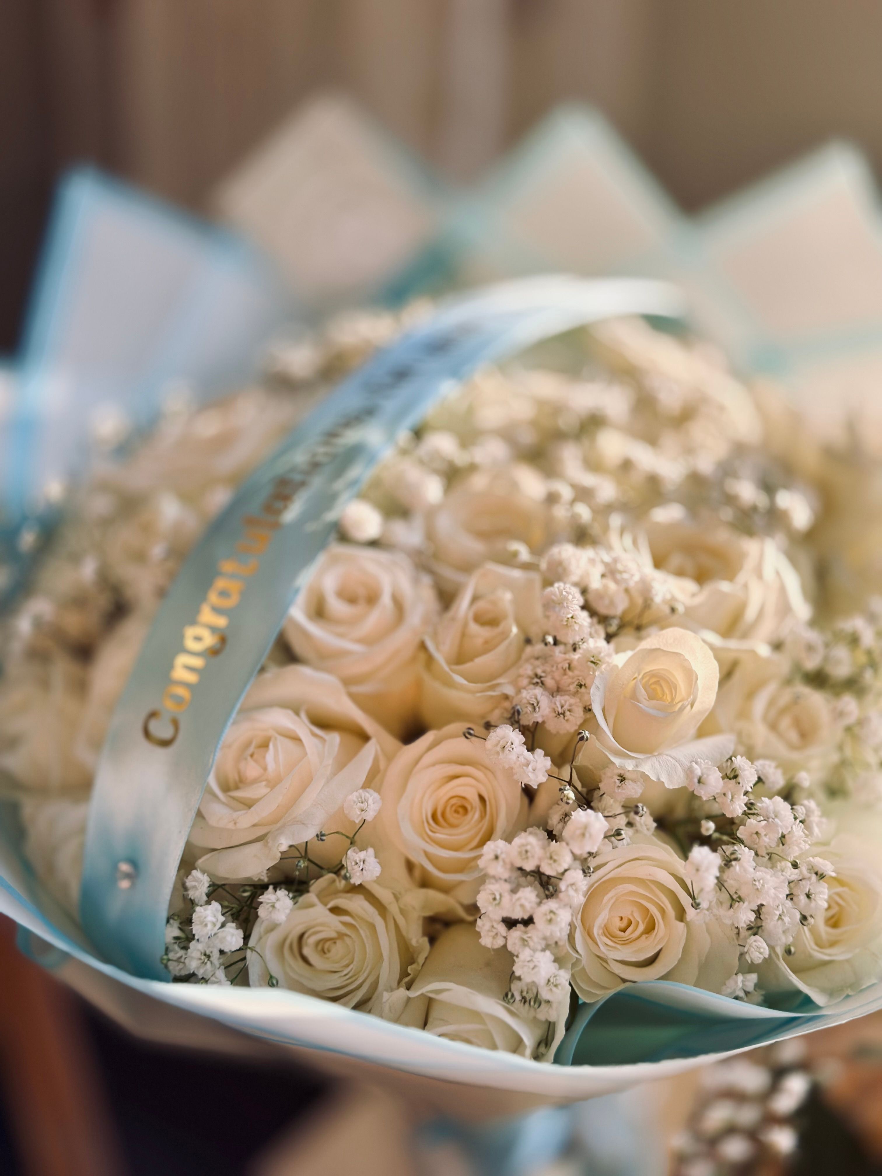 [ColoSach]-a-beautiful-bouquet-featuring-white-roses-and-baby's-breath,-perfect-for-weddings-or-celebrations.