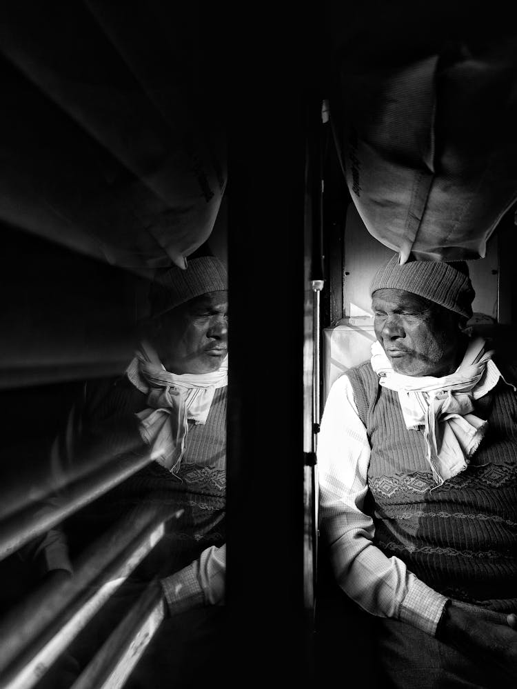 Pensive Ethnic Man Traveling By Train