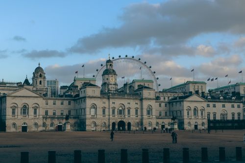 Free Captivating view of Horse Guards Parade and London Eye under a blue sky in London. Stock Photo