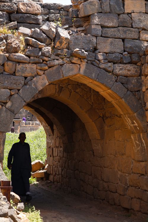 Free Explore historic Roman ruins in Syria with ancient stone arches under the bright summer sun. Stock Photo