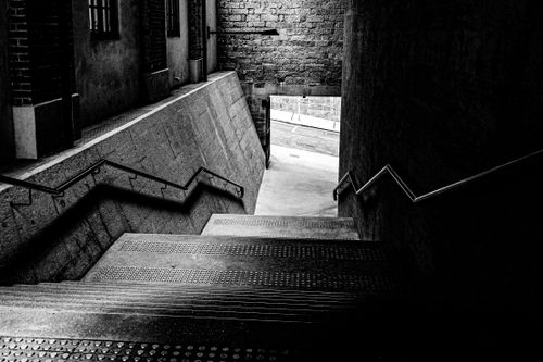Free Dramatic black and white image of a concrete staircase leading outdoors in Hong Kong. Stock Photo