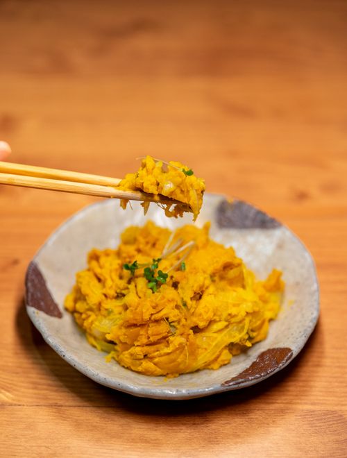 Free Close-up of Asian pumpkin mash served in a ceramic bowl, highlighting authenticity and flavor. Stock Photo