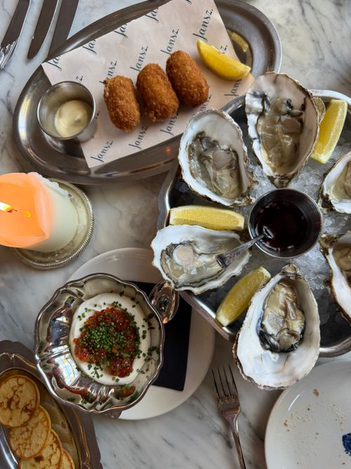 Free Luxurious seafood spread with oysters, caviar, and croquettes in a sophisticated setting. Stock Photo