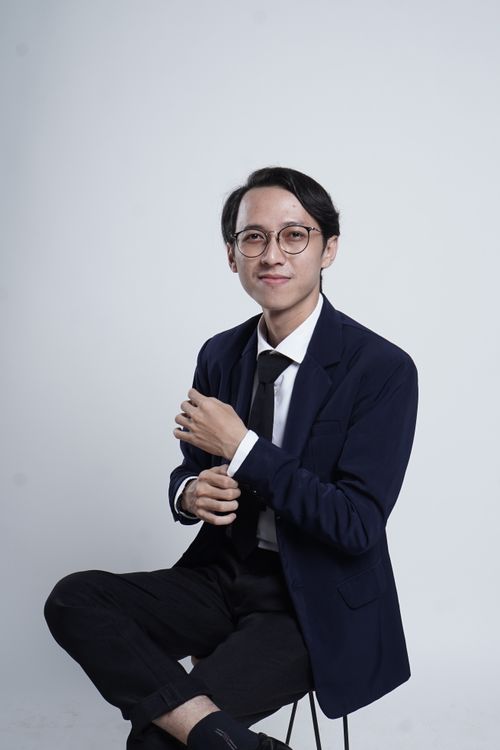 Free Professional portrait of a young adult in formal attire. Ideal for business and lifestyle themes. Stock Photo