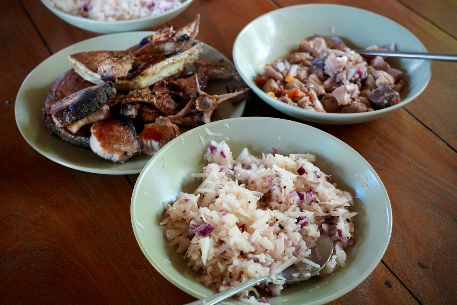 A delicious spread of grilled fish, rice, and meat dishes, typical of Filipino cuisine.