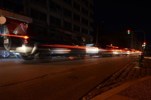 Captivating long exposure shot capturing motion blur of city traffic at night.
