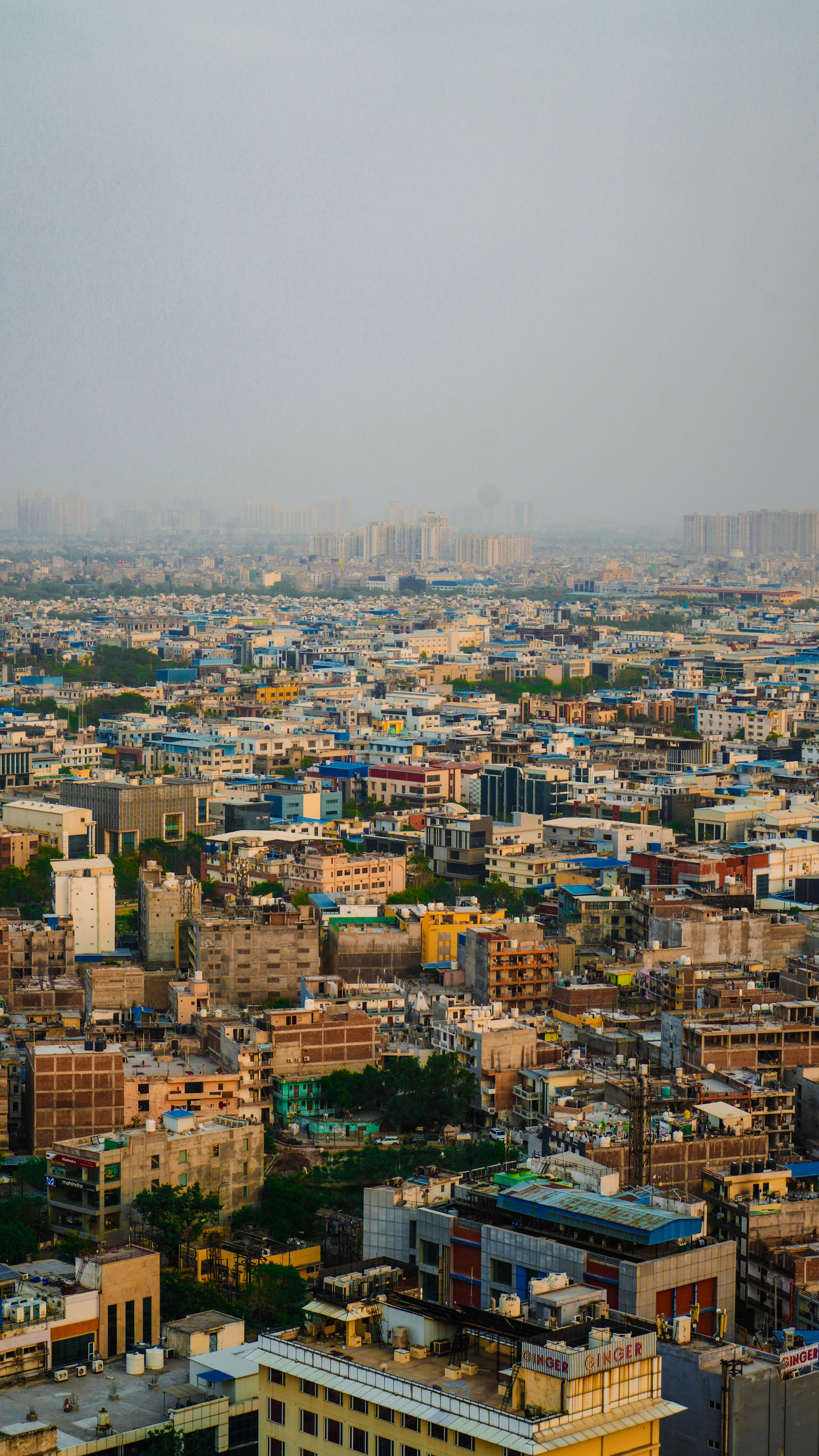 Expansive cityscape view during daylight depicting dense urban architecture and buildings.