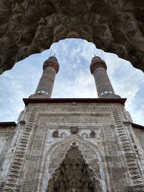 Free Captivating view of a historic architectural masterpiece with twin minarets under a blue sky. Stock Photo