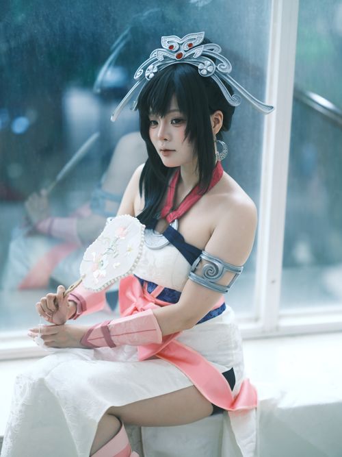Free Elegant Asian woman in detailed cosplay costume with intricate accessories indoors. Stock Photo
