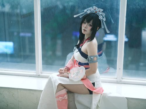 Free A portrait of a female cosplayer in traditional costume sitting by a window, with natural daylight enhancing the details. Stock Photo