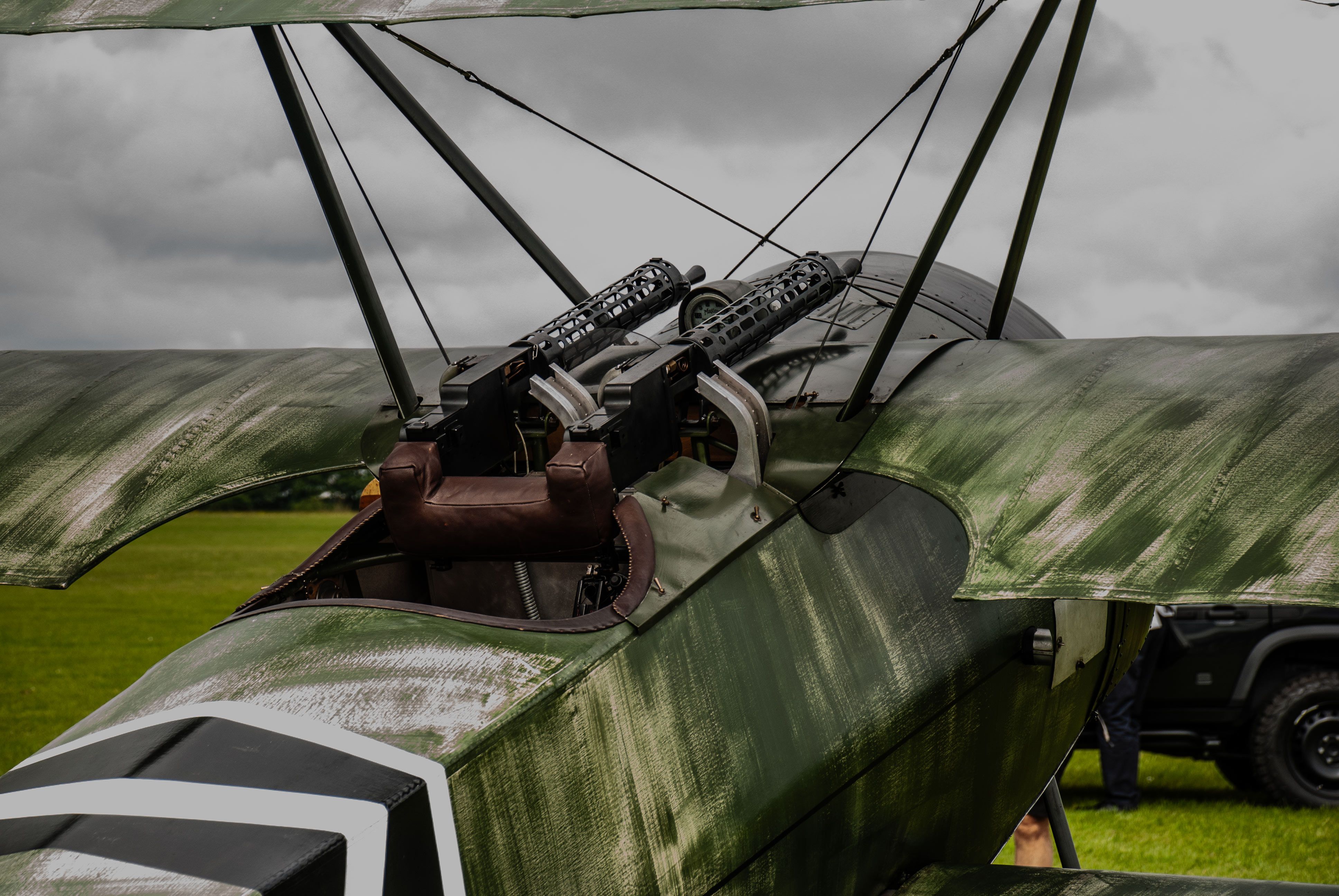 A red and white biplane sitting on a runway · Free Stock Photo