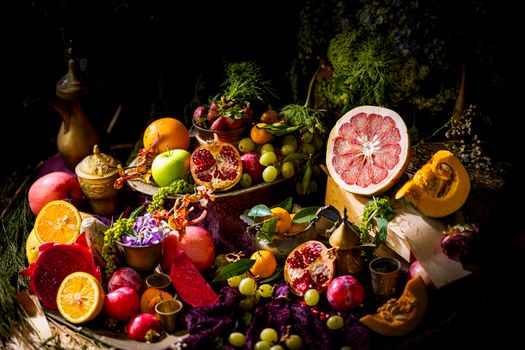 A colorful and artistic still life of assorted exotic fruits and vegetables, showcasing a vibrant and lush composition.