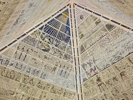 Detailed artistic ceiling in a Dubai landmark, showcasing symmetry and intricate design.