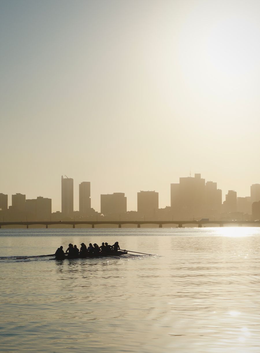 A rowing crew silhouetted against a sunrise skyline. Photo by Ren Aukeman on Pexels