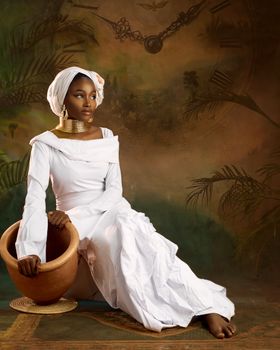 Woman in white traditional dress seated with a clay pot, earthy backdrop.