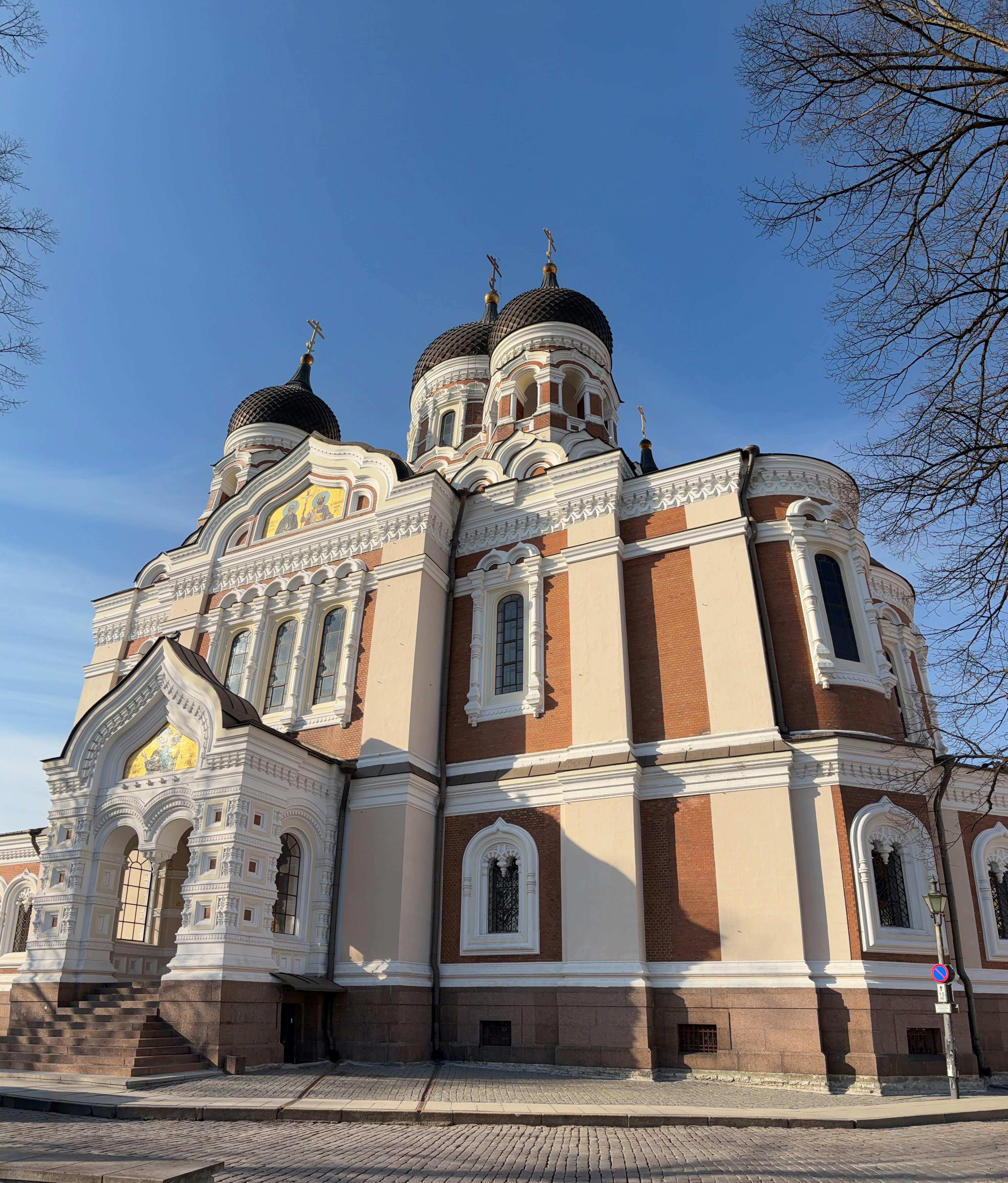 Beautiful daytime shot of the Alexander Nevsky Cathedral in Tallinn, Estonia with clear blue skies.
