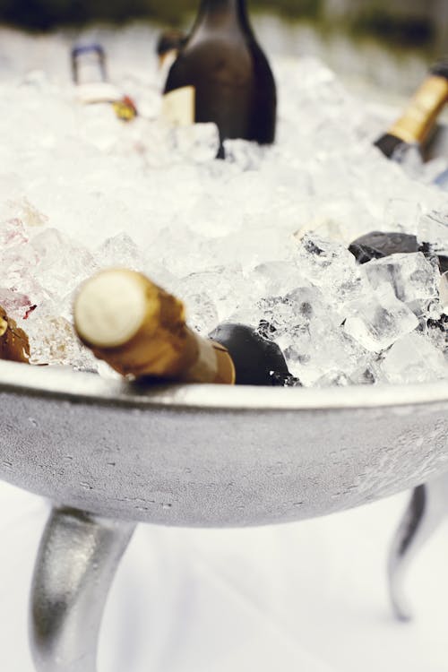 Free Wine Bottles in Stainless Steel Tray Filled With Ice Stock Photo