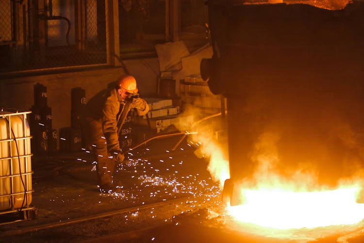 Man In Helmet And Mask Welding Steel