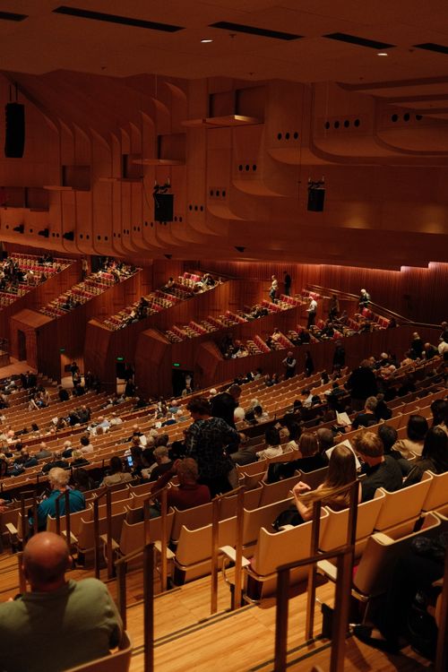 Free View from above of an audience gathering in the iconic Sydney Opera House Concert Hall. Stock Photo