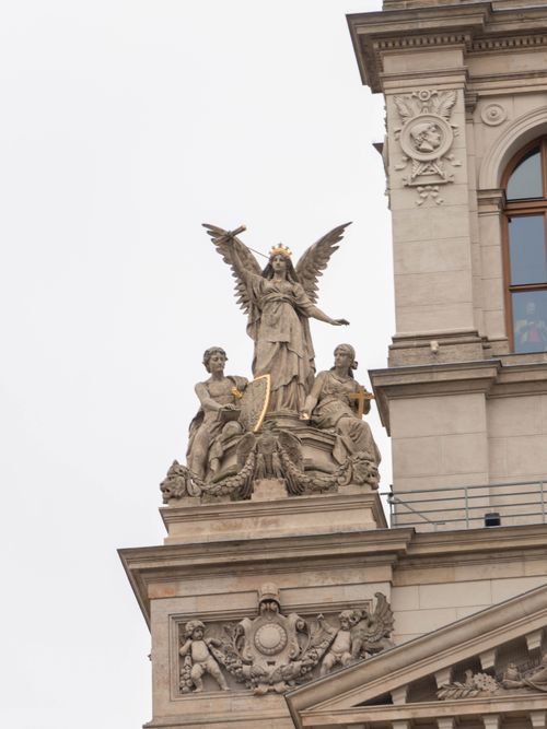 Free Detailed view of angelic sculptures on a historic building facade. Stock Photo