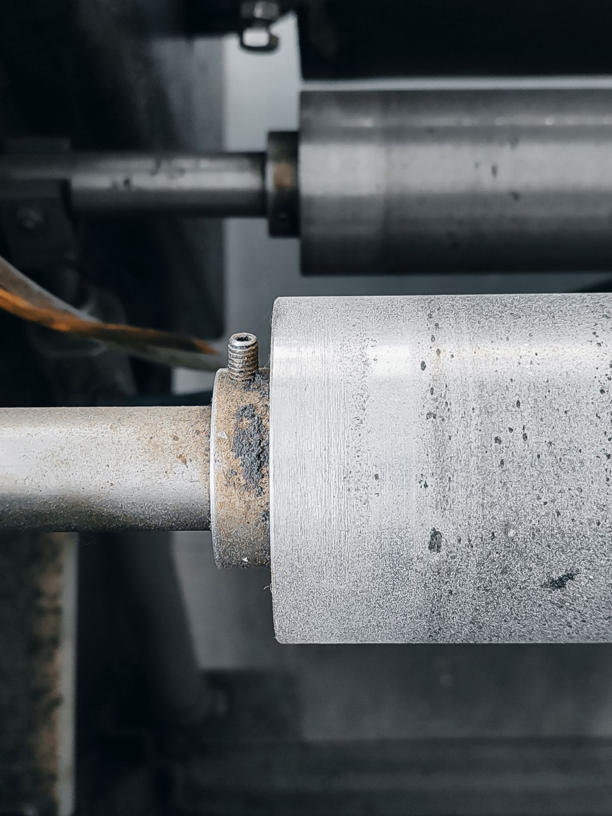 Close-up of polished industrial metal rollers
